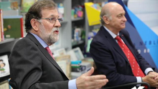 Rajoy, junto a Fernández Díaz, en la presentación de las memorias de este último, en 2019.