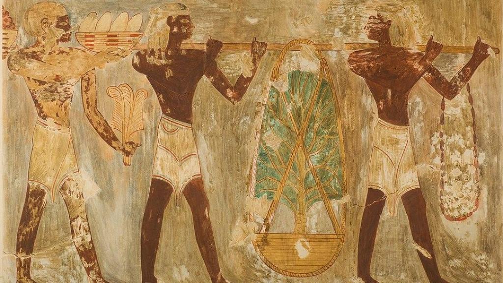 Hombres del país de Punt portando regalos en una pintura mural en una tumba de Egipto.
