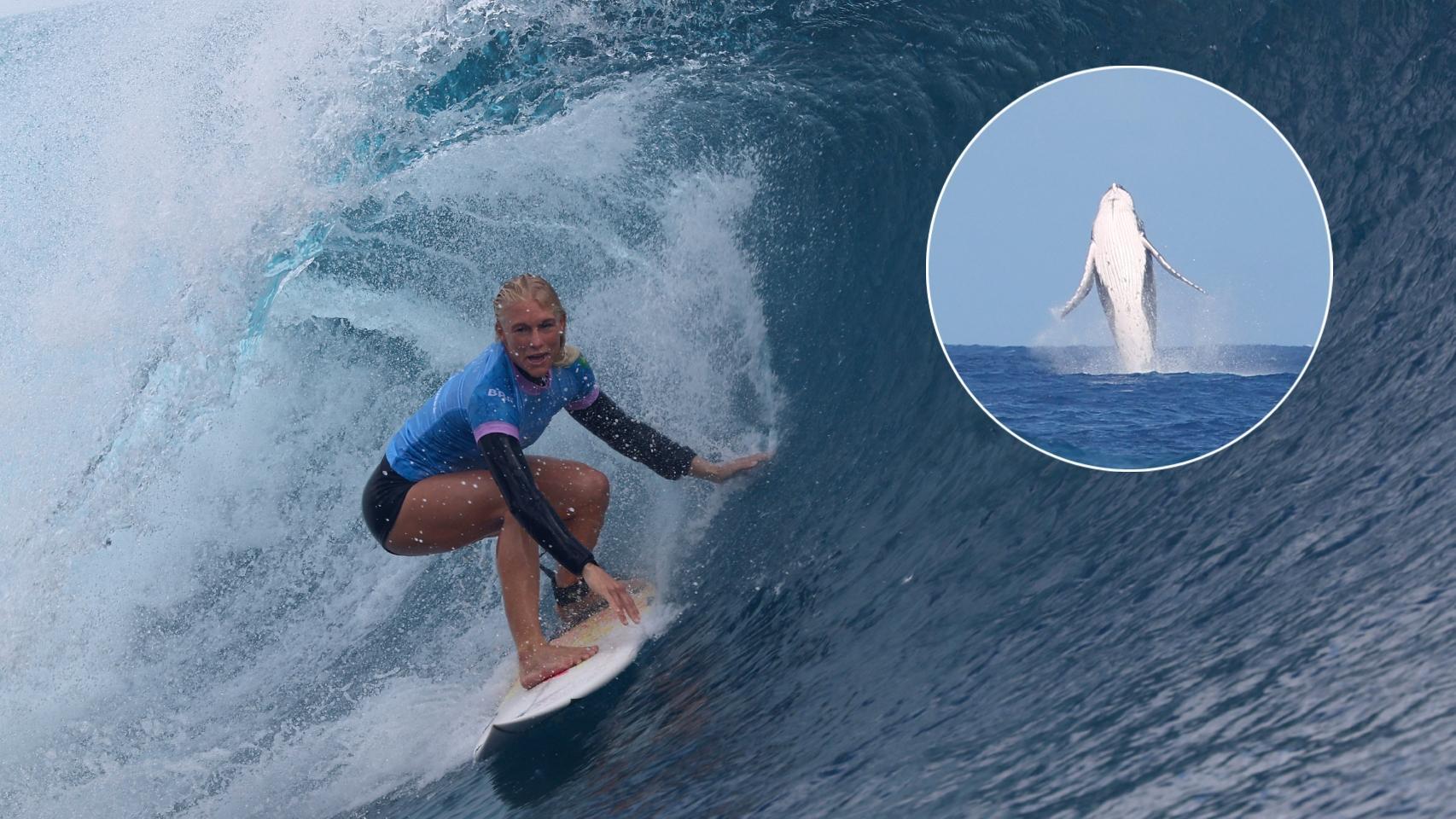La surfista brasileña Tatiana Weston-Webb junto a una ballena que se ha colado en la competición.