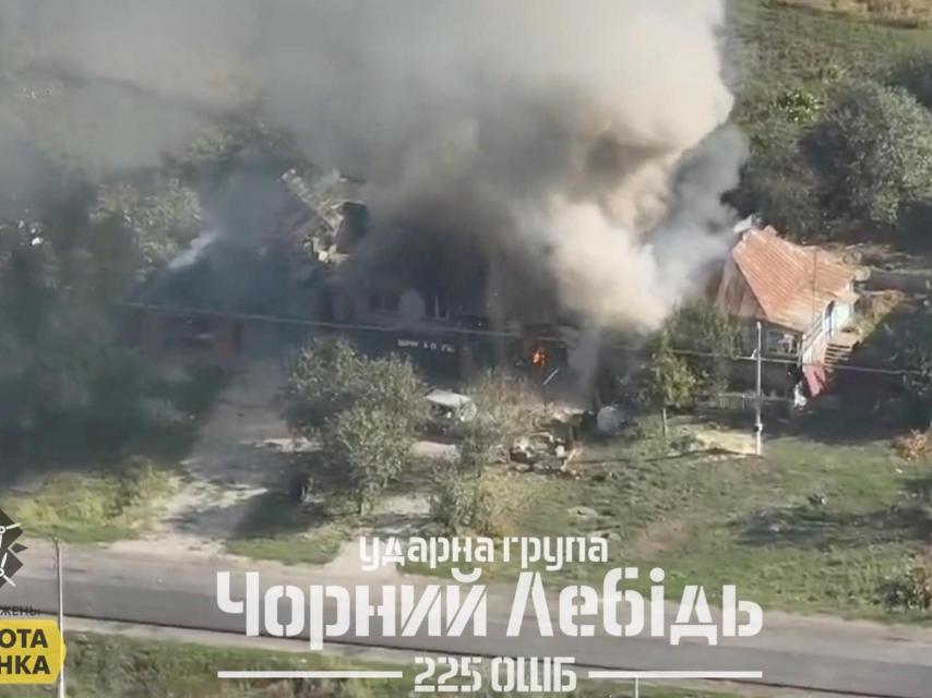 An aerial view shows smoke rising from a burning Russian building following a Ukrainian military operation in Korenevo, Kursk region, Russia, in this screenshot taken from a video posted on August 29, 2024. Black Swan unit of the 225th Separate Assault Battalion.