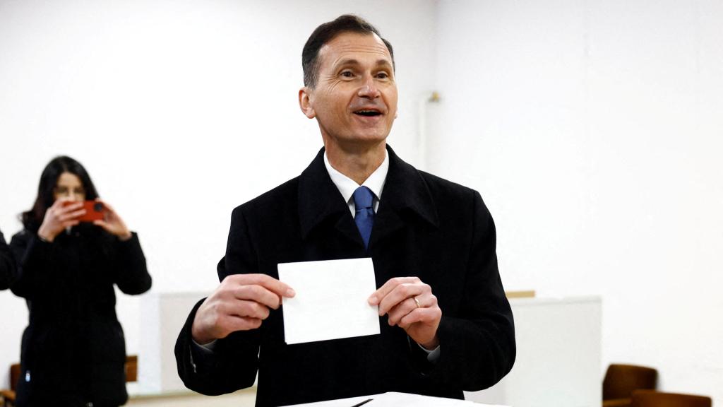 Presidential candidate Dragan Primorac votes at a polling station during the second round of the presidential elections in Zagreb.