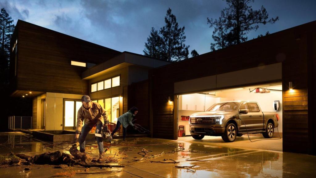 A Ford truck giving electricity to a house