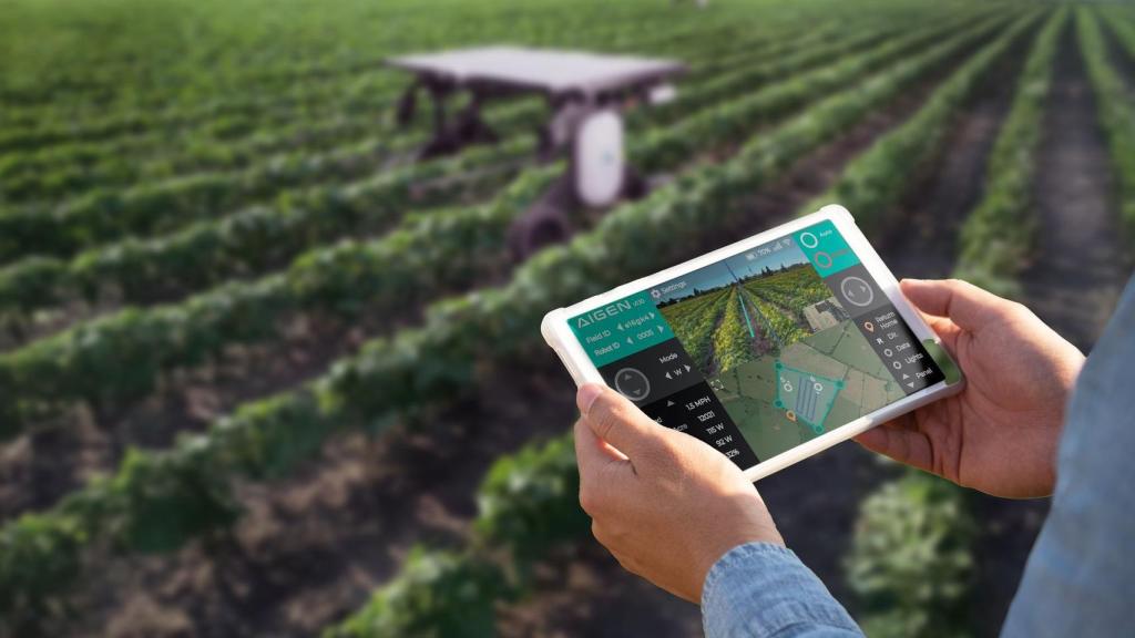 Una persona con una tablet y el robot Element de Aigen.